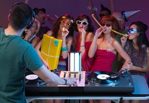 DJ and guests dancing at a party at the John Godber Centre, Hucknall