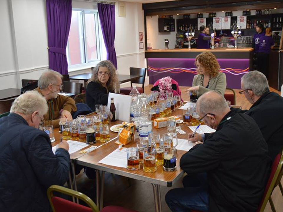 The judges' final deliberation in the Champion Beer of Nottinghamshire competition 2019