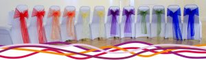 Selection of chairs dressed for a Wedding reception at the John Godber Centre, Hucknall